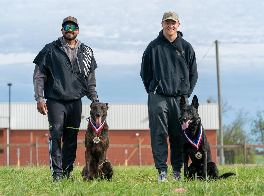 Sufian and David with their dogs after competition